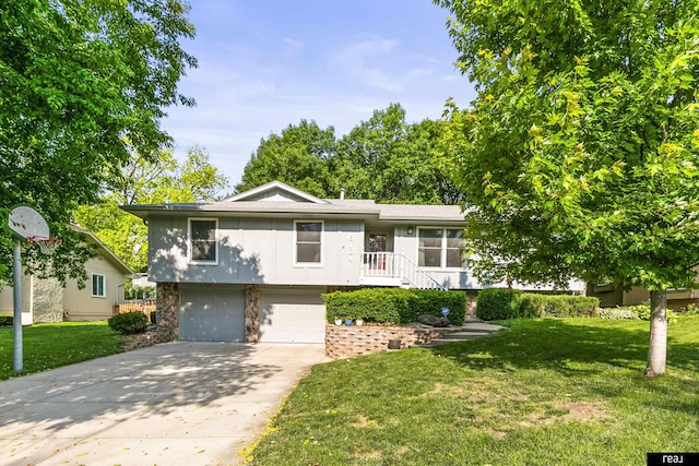 6104 S 93rd St, Omaha, NE 68127 - view of front facade with an attached garage, a front yard, concrete driveway, and stone siding