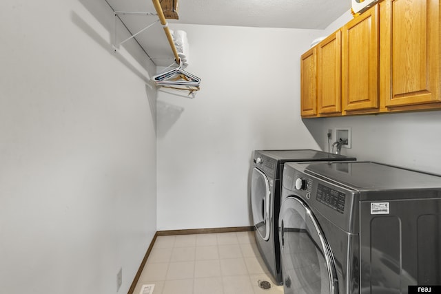 6104 S 93rd St, Omaha, NE 68127 - washroom featuring cabinet space, independent washer and dryer, and baseboards
