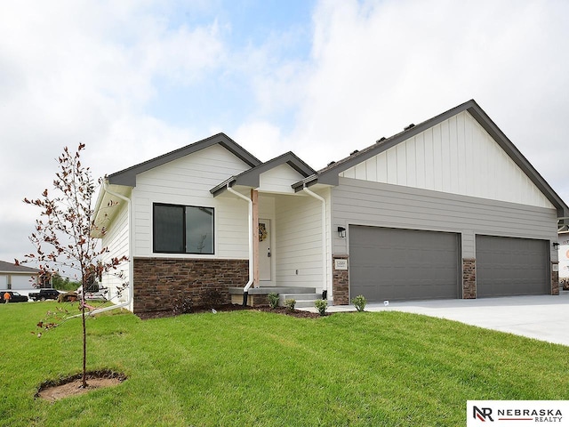 14802 Bruning St, Bennington, NE 68007 - view of front of property featuring stone siding, a front yard, a garage, and driveway