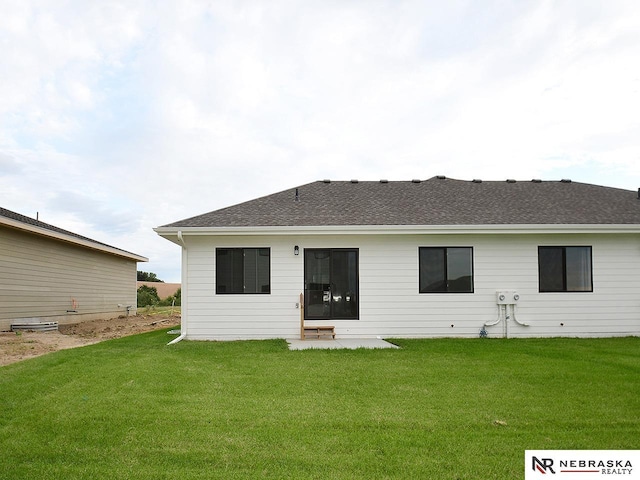 14802 Bruning St, Bennington, NE 68007 - back of property with a yard and roof with shingles
