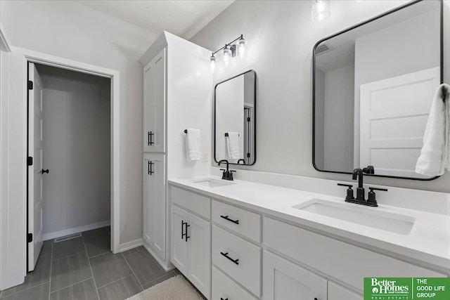 6518 S 208th Ave, Elkhorn, NE 68022 - bathroom featuring double vanity and baseboards