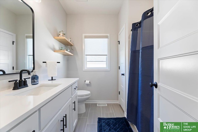 6518 S 208th Ave, Elkhorn, NE 68022 - full bath with vanity, toilet, baseboards, and curtained shower