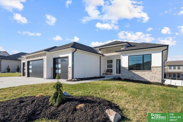6518 S 208th Ave, Elkhorn, NE 68022 - prairie-style house featuring a garage, concrete driveway, a front yard, and stone siding