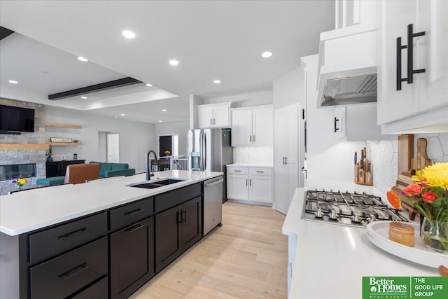 6518 S 208th Ave, Elkhorn, NE 68022 - kitchen featuring a sink, white cabinets, light countertops, a kitchen island with sink, and recessed lighting