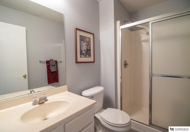 15417 Willit St, Bennington, NE 68007 - bathroom featuring toilet, a shower stall, and vanity