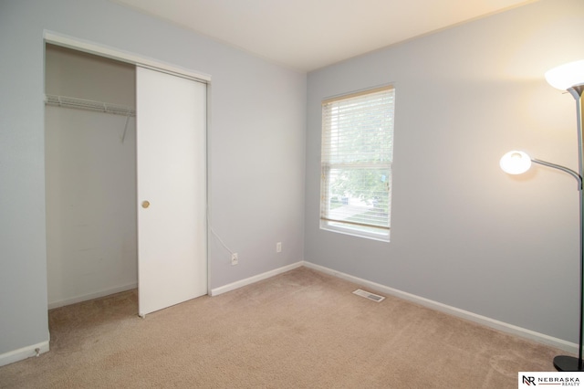 15417 Willit St, Bennington, NE 68007 - unfurnished bedroom with light carpet, a closet, and baseboards