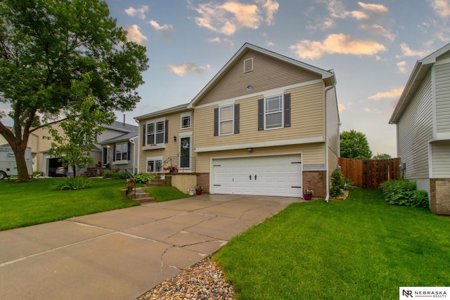 15417 Willit St, Bennington, NE 68007 - bi-level home with a garage, brick siding, and driveway