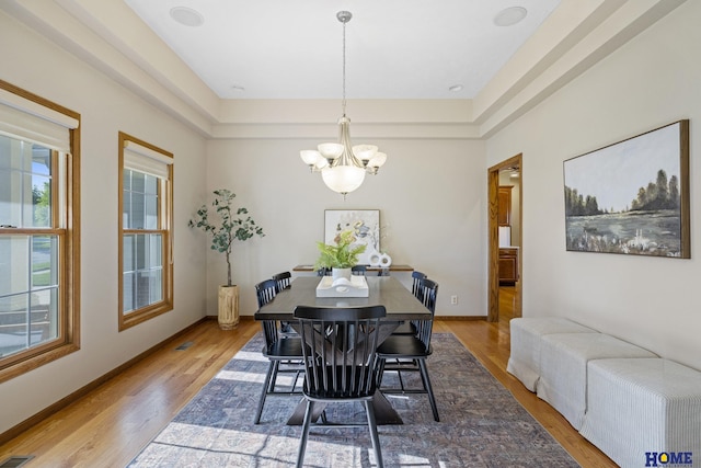 6920 NW 3rd St, Lincoln, NE 68521 - dining space featuring a chandelier, wood finished floors, and baseboards