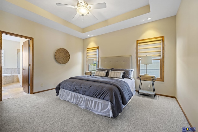 6920 NW 3rd St, Lincoln, NE 68521 - carpeted bedroom featuring baseboards, multiple windows, connected bathroom, recessed lighting, and a ceiling fan