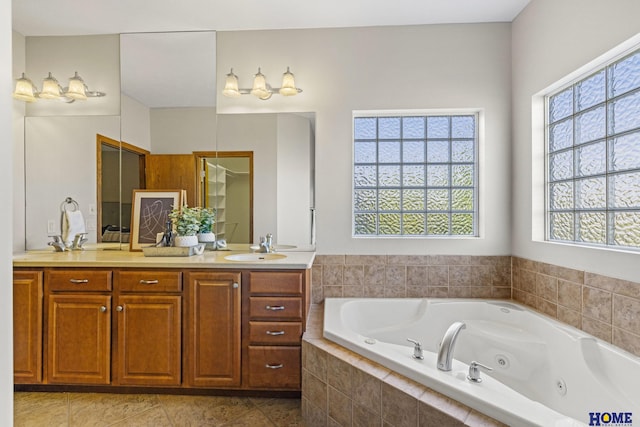 6920 NW 3rd St, Lincoln, NE 68521 - bathroom featuring double vanity, a whirlpool tub, and tile patterned floors
