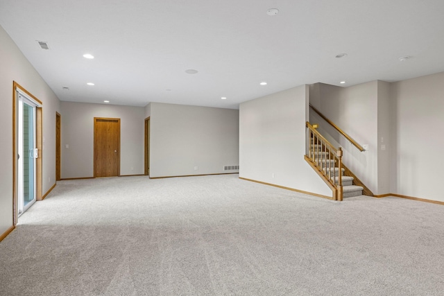 6920 NW 3rd St, Lincoln, NE 68521 - unfurnished room with light carpet, baseboards, stairs, and recessed lighting