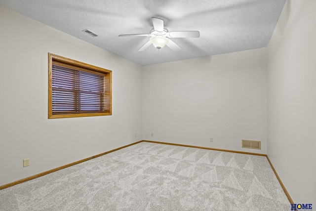 6920 NW 3rd St, Lincoln, NE 68521 - carpeted spare room featuring ceiling fan, baseboards, and a textured ceiling