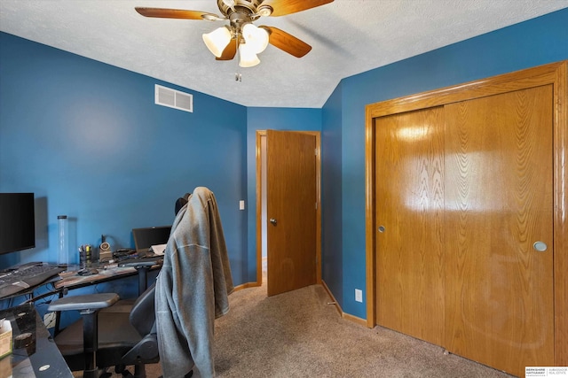 15212 Emmet St, Omaha, NE 68116 - home office featuring carpet floors, a ceiling fan, baseboards, and a textured ceiling