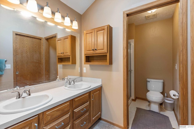 15212 Emmet St, Omaha, NE 68116 - bathroom featuring toilet, double vanity, and a shower stall