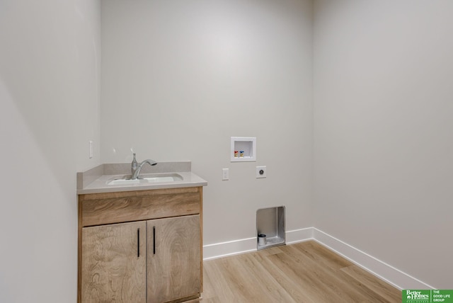 21056 Joseph St, Elkhorn, NE 68022 - laundry room featuring electric dryer hookup, hookup for a washing machine, light wood-type flooring, baseboards, and cabinet space