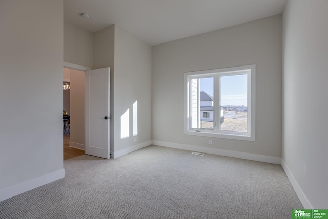 21056 Joseph St, Elkhorn, NE 68022 - empty room with carpet flooring, baseboards, and a smoke detector