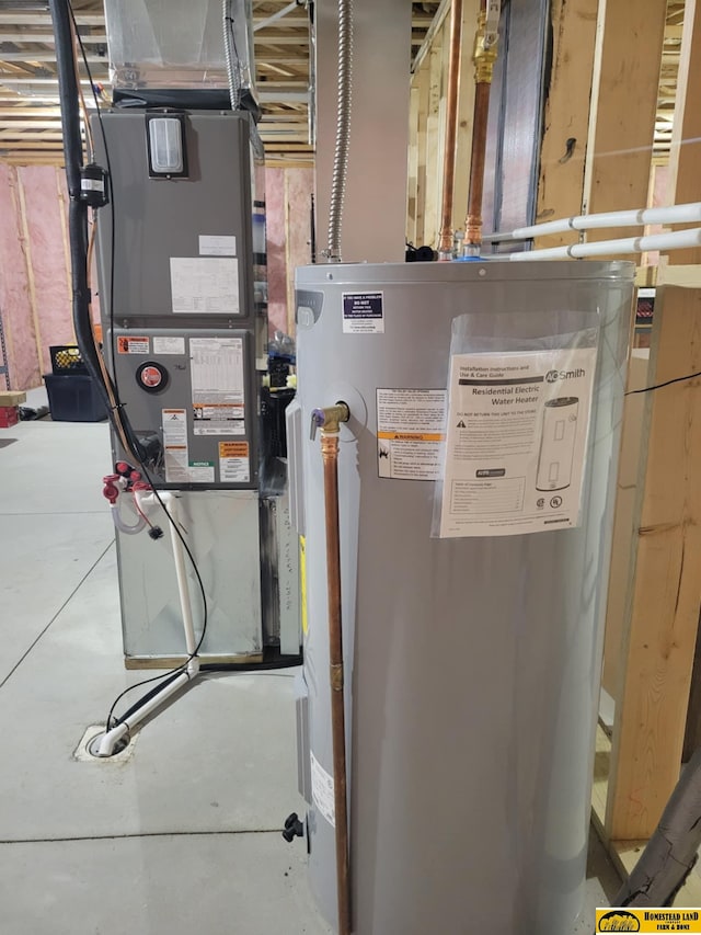 843 N 26th St, Beatrice, NE 68310 - utility room featuring gas water heater and heating unit