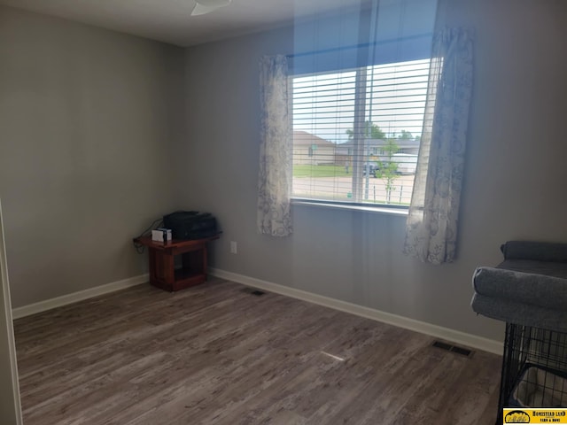 843 N 26th St, Beatrice, NE 68310 - spare room featuring wood finished floors and baseboards