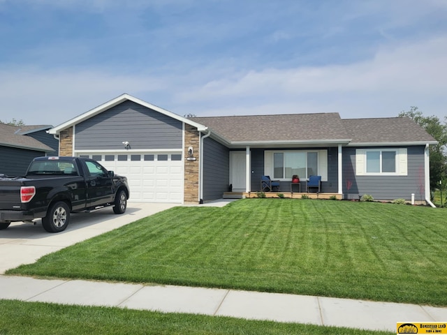 843 N 26th St, Beatrice, NE 68310 - single story home featuring a porch, an attached garage, a front yard, and driveway