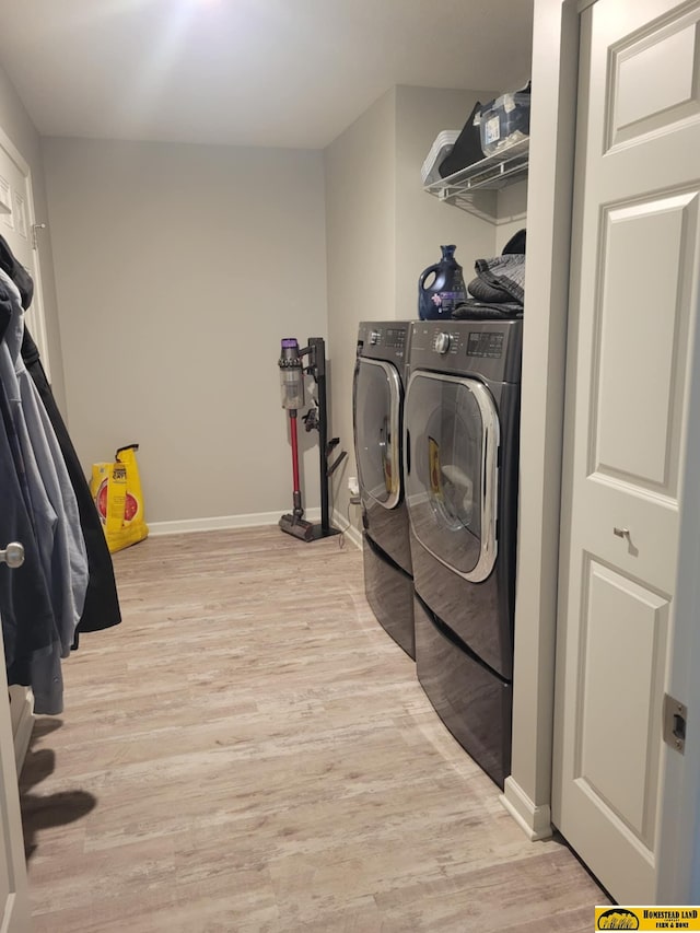 843 N 26th St, Beatrice, NE 68310 - laundry area featuring washing machine and clothes dryer and light wood-style flooring