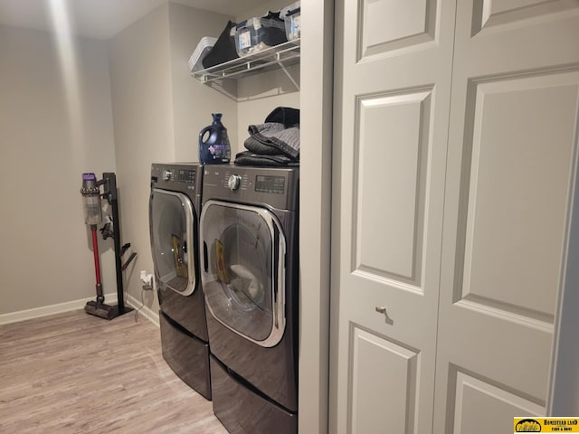 843 N 26th St, Beatrice, NE 68310 - laundry room with independent washer and dryer and light wood-type flooring