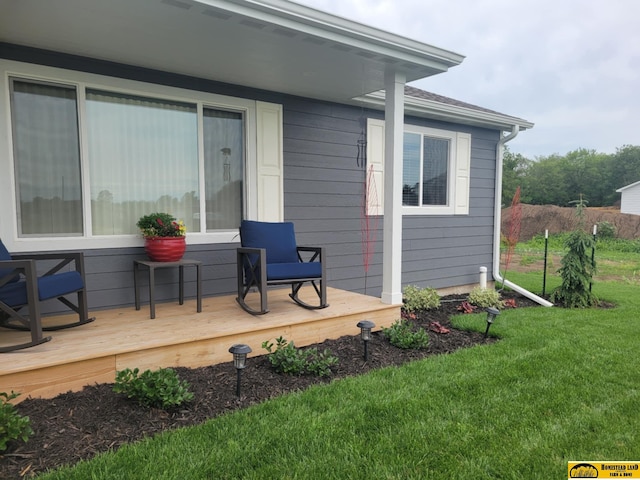 843 N 26th St, Beatrice, NE 68310 - wooden deck featuring a lawn