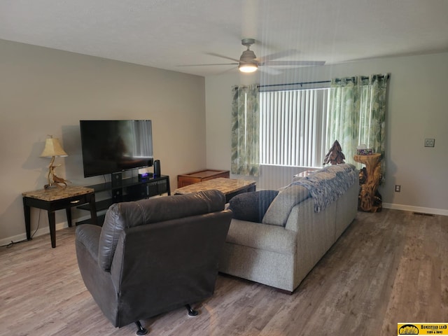 843 N 26th St, Beatrice, NE 68310 - living area with wood finished floors and ceiling fan
