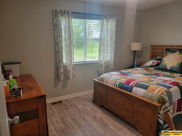 843 N 26th St, Beatrice, NE 68310 - bedroom with light wood-style floors and baseboards