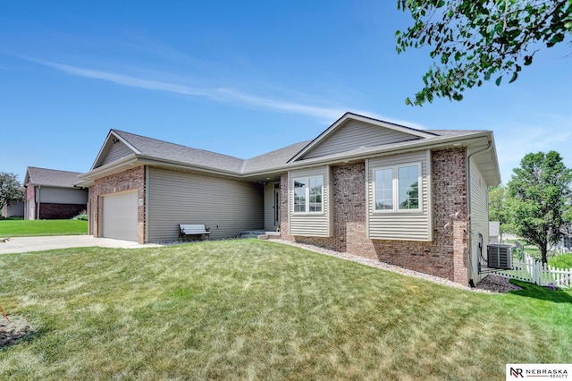 905 Chicory Ln, Hickman, NE 68372 - ranch-style house featuring brick siding, cooling unit, an attached garage, and driveway