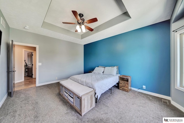 905 Chicory Ln, Hickman, NE 68372 - bedroom with carpet floors, a raised ceiling, and baseboards