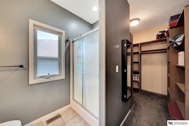 905 Chicory Ln, Hickman, NE 68372 - bathroom with a shower stall, baseboards, and toilet