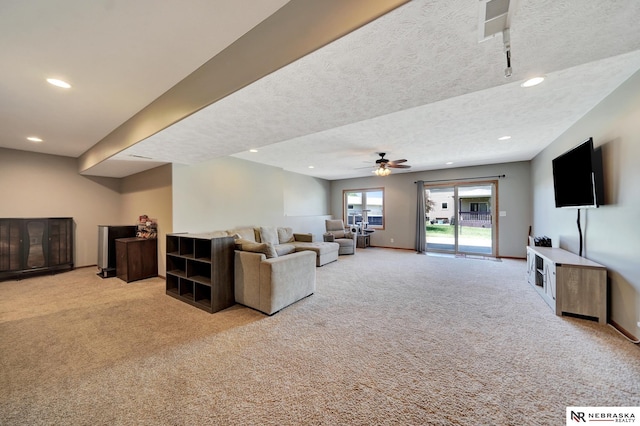 905 Chicory Ln, Hickman, NE 68372 - living room featuring carpet, ceiling fan, recessed lighting, a textured ceiling, and baseboards