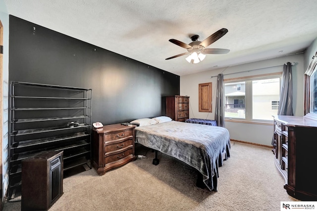 905 Chicory Ln, Hickman, NE 68372 - bedroom with light colored carpet, a textured ceiling, ceiling fan, and baseboards