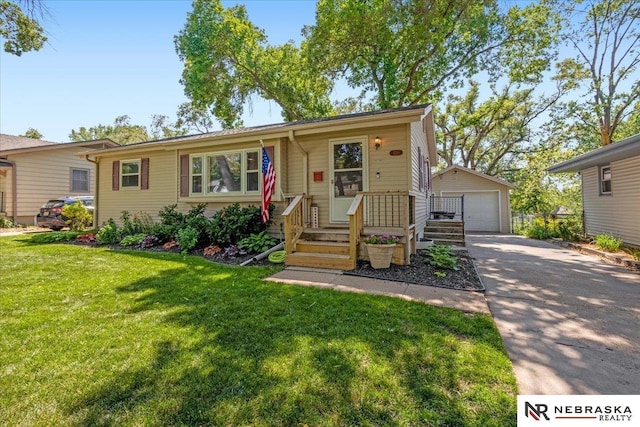 1740 N 84th St, Omaha, NE 68114 - view of front of property with an outbuilding, a detached garage, a front yard, and driveway