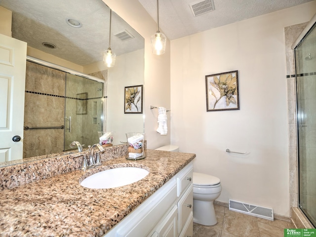 6212 Oak Hills Plz, Omaha, NE 68137 - bathroom featuring toilet, vanity, a stall shower, tile patterned floors, and baseboards