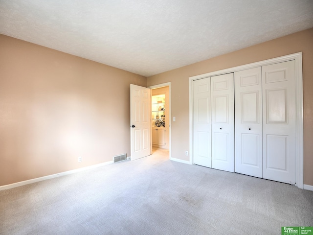 6212 Oak Hills Plz, Omaha, NE 68137 - unfurnished bedroom featuring light colored carpet, baseboards, and a closet