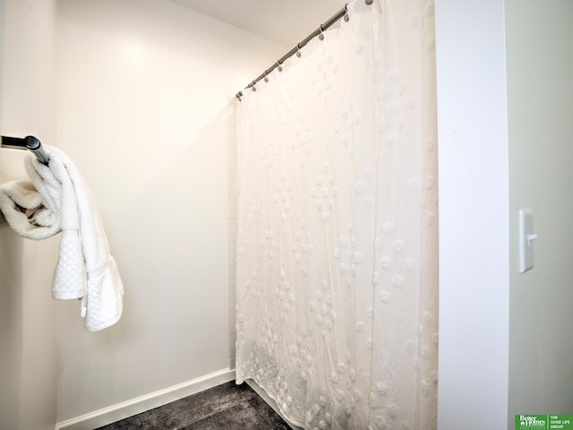 6212 Oak Hills Plz, Omaha, NE 68137 - full bathroom with baseboards, wood finished floors, and a shower with curtain
