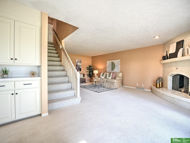 6212 Oak Hills Plz, Omaha, NE 68137 - unfurnished living room with light colored carpet, stairway, baseboards, a fireplace, and a textured ceiling