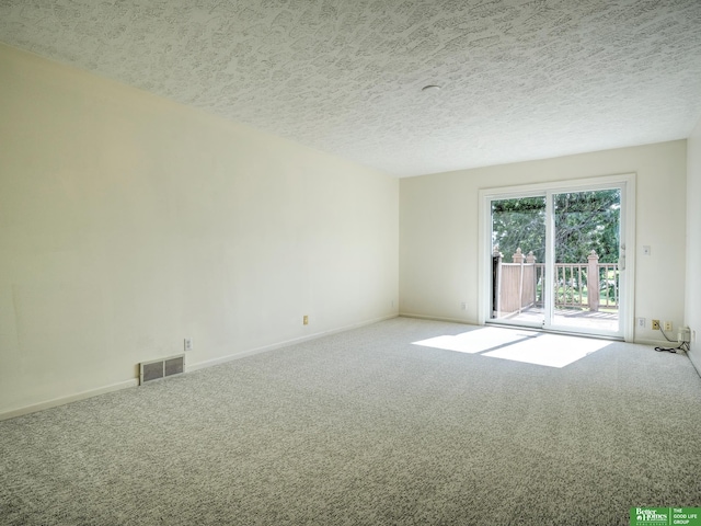 6212 Oak Hills Plz, Omaha, NE 68137 - carpeted empty room featuring a textured ceiling and baseboards