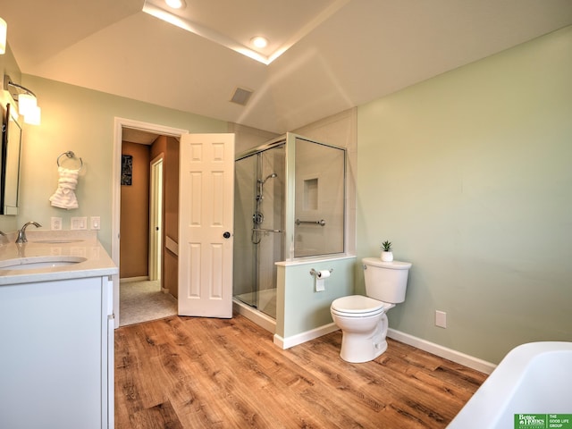 6212 Oak Hills Plz, Omaha, NE 68137 - full bath featuring double vanity, a stall shower, wood finished floors, toilet, and a soaking tub
