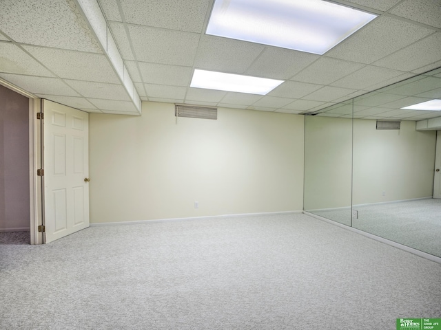 6212 Oak Hills Plz, Omaha, NE 68137 - finished below grade area with carpet flooring, a paneled ceiling, and baseboards