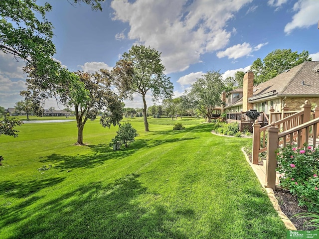 6212 Oak Hills Plz, Omaha, NE 68137 - view of green lawn with a deck