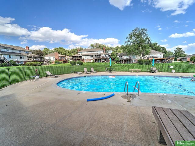 6212 Oak Hills Plz, Omaha, NE 68137 - community pool featuring a residential view and a patio area