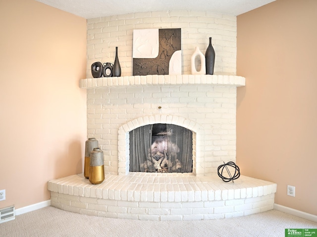6212 Oak Hills Plz, Omaha, NE 68137 - detailed view of carpet flooring, baseboards, and a brick fireplace