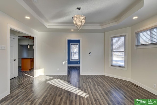 2864 Spaulding St, Omaha, NE 68111 - unfurnished room with a tray ceiling, plenty of natural light, baseboards, a chandelier, and recessed lighting