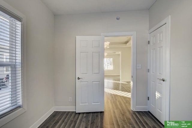 2864 Spaulding St, Omaha, NE 68111 - empty room with dark wood finished floors and baseboards