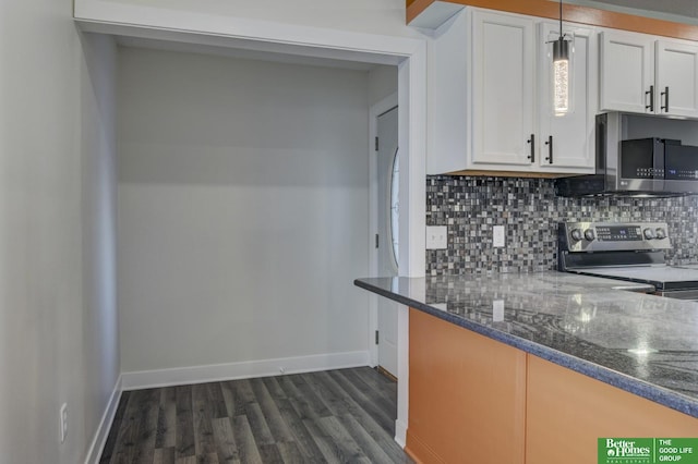 2864 Spaulding St, Omaha, NE 68111 - kitchen with stainless steel appliances, tasteful backsplash, white cabinetry, and dark wood-style floors