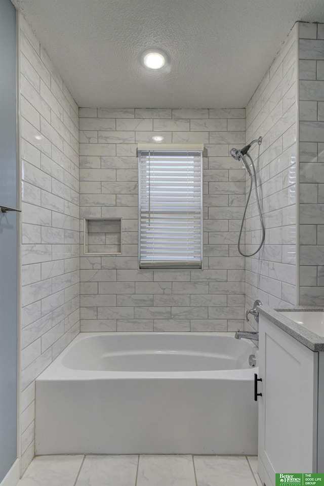 2864 Spaulding St, Omaha, NE 68111 - full bath with a textured ceiling, shower / bathtub combination, vanity, and tile patterned floors