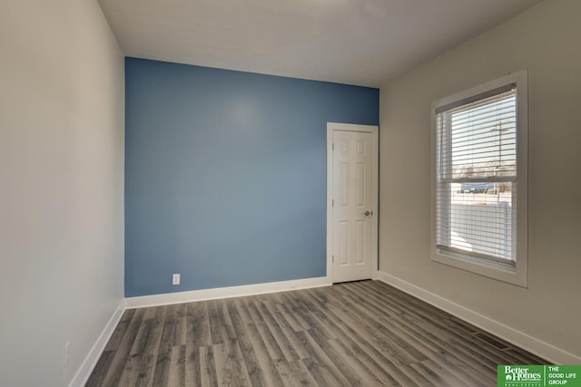 2864 Spaulding St, Omaha, NE 68111 - unfurnished room featuring dark wood-style floors and baseboards