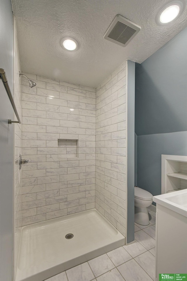 2864 Spaulding St, Omaha, NE 68111 - bathroom with toilet, a textured ceiling, a stall shower, and vanity
